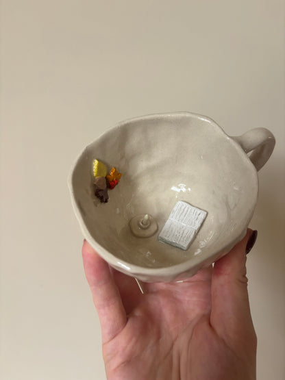 Snuggle up with a book by candle light flat white