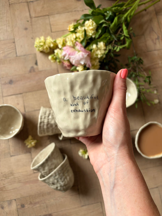 A beautiful kind of exhaustion handwritten mug