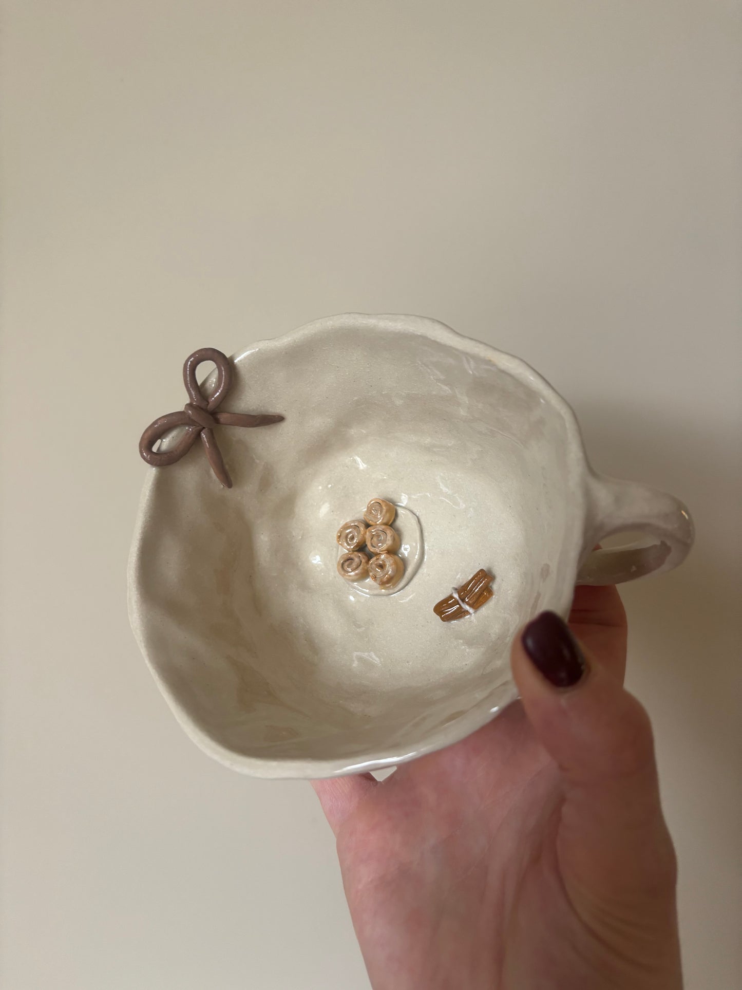 Cinnamon rolls, cinnamon sticks and bow mug