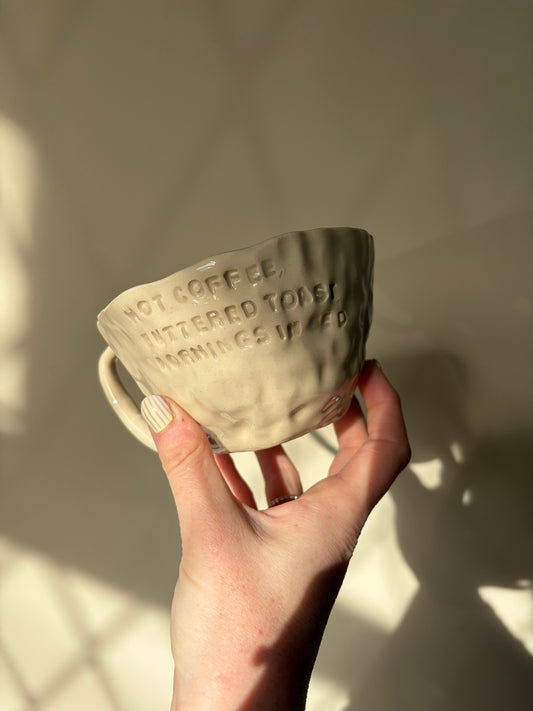 Hot coffee, buttered toast in bed mug