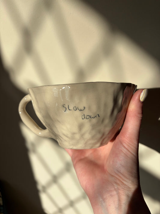 ‘Slow down’ hand written mug