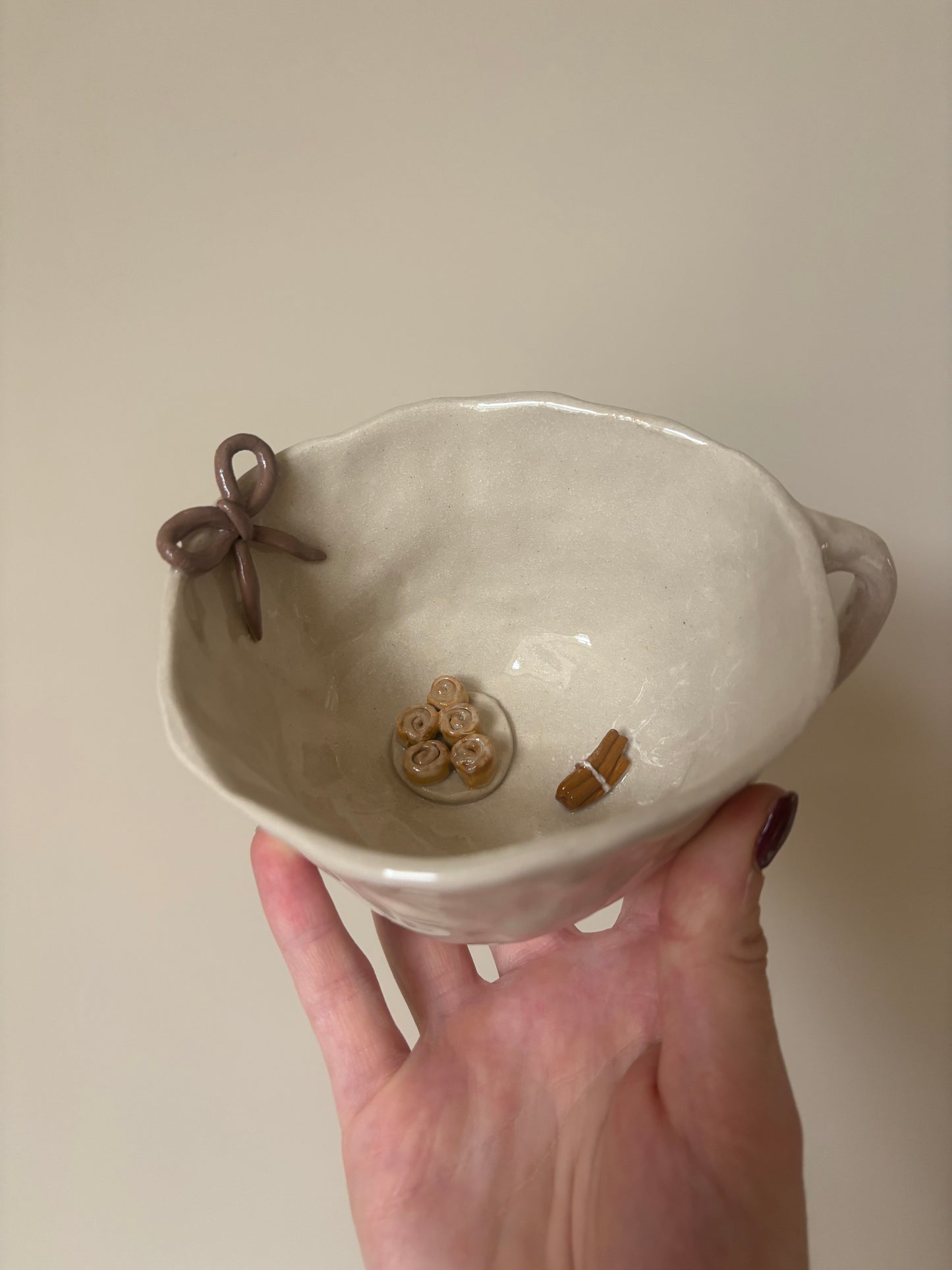 Cinnamon rolls, cinnamon sticks and bow mug