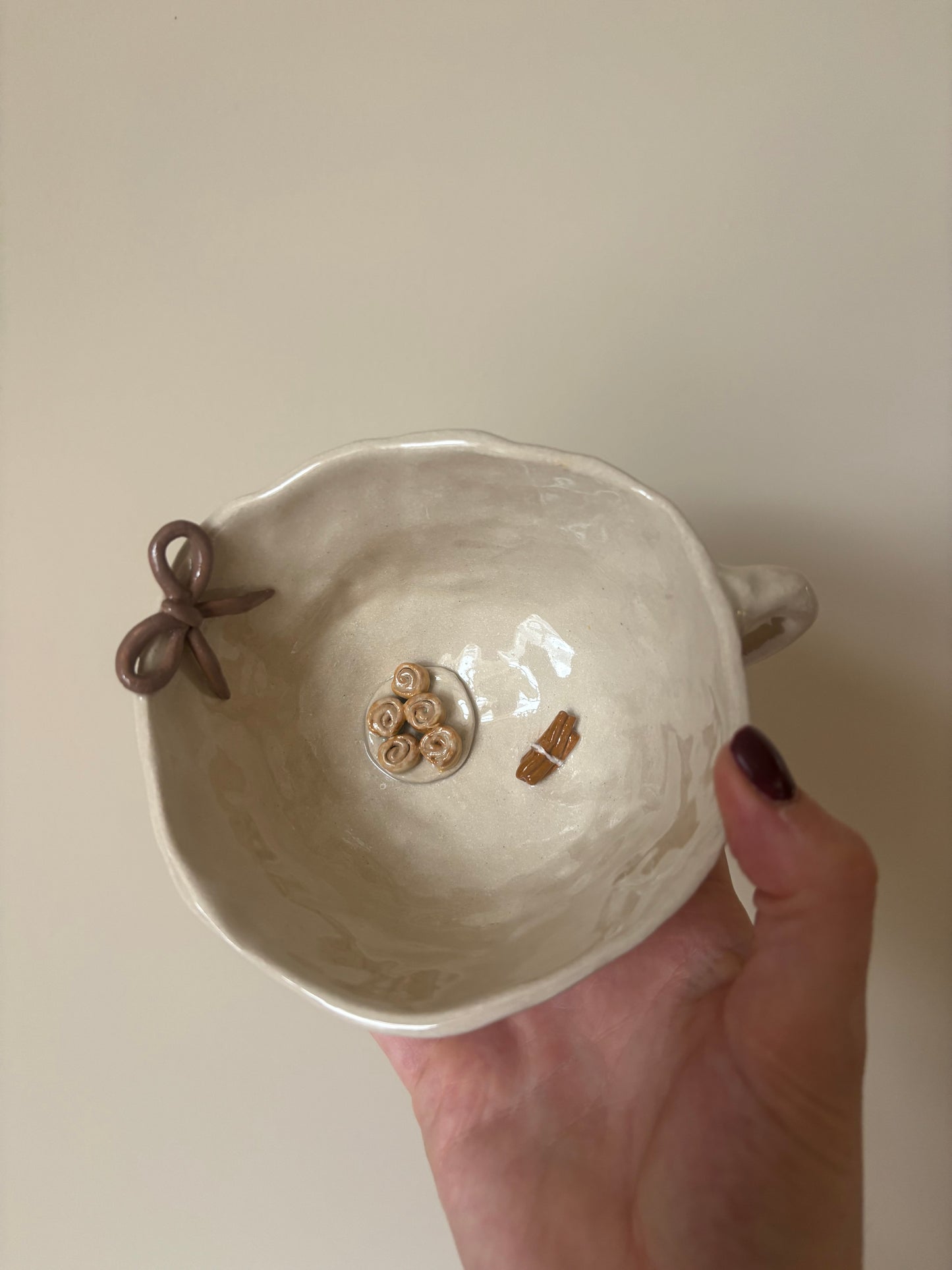 Cinnamon rolls, cinnamon sticks and bow mug
